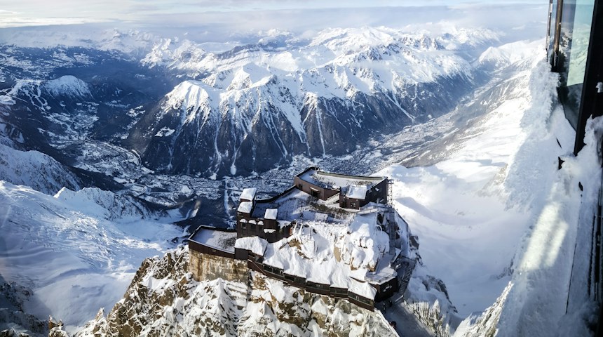 Aerial view of snow-covered chalets in the French Alps