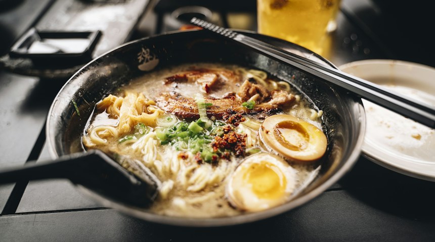 Bowl of Japanese ramen with chopsticks, an affordable meal in Japan