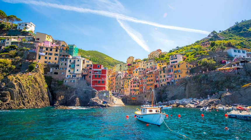 Blue fishing boat in the harbour of a Cinque Terre village