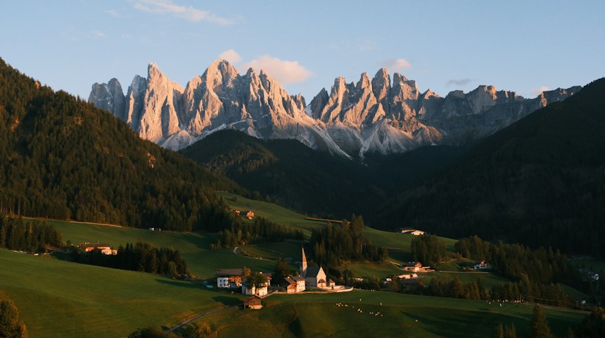 Small alpine village nestled in a valley in the Dolomites