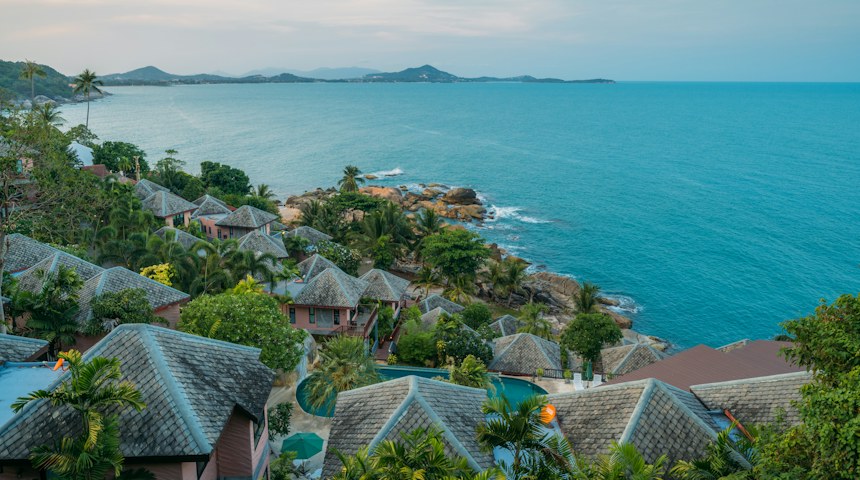 Palm trees lining a quiet beach on Koh Samui