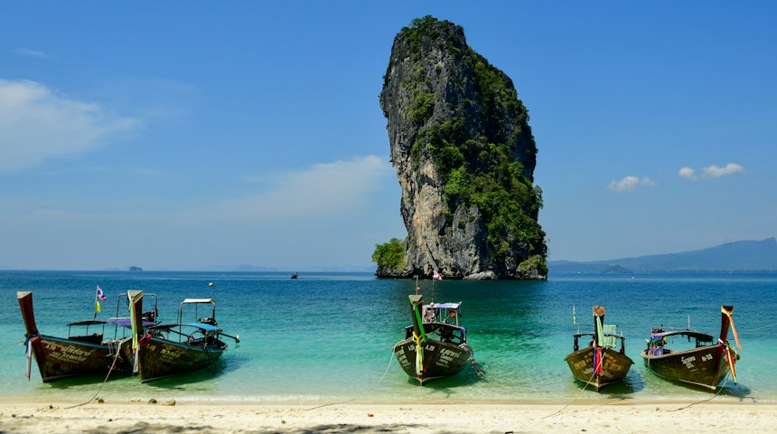 Longtail boats on a tropical beach in Krabi