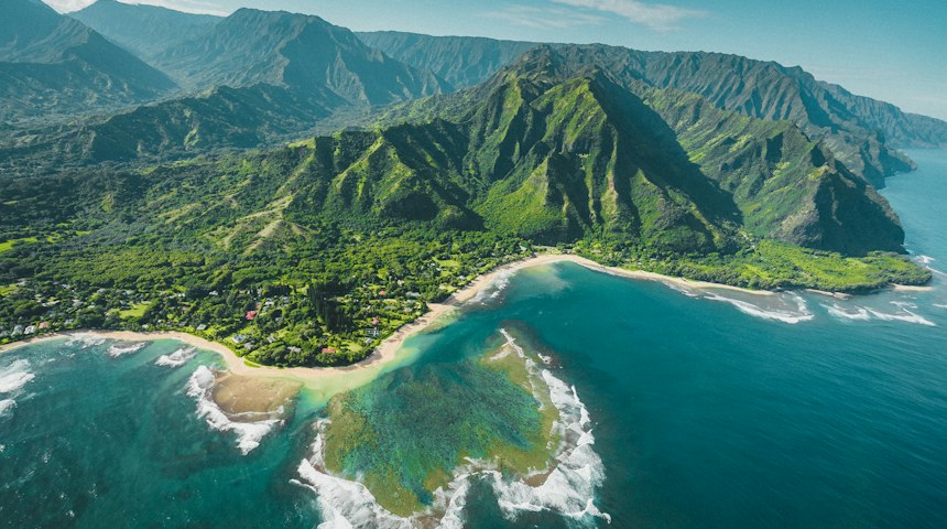 Aerial view of lush green cliffs on Kauai