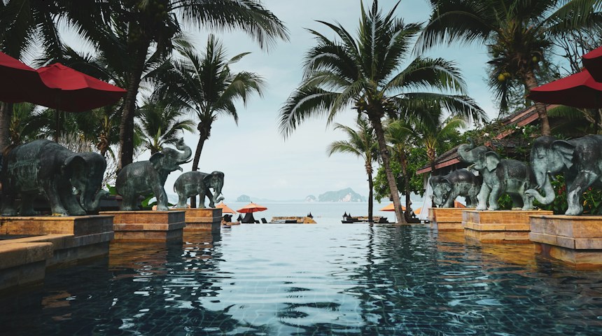 Curved swimming pool at a tropical luxury resort