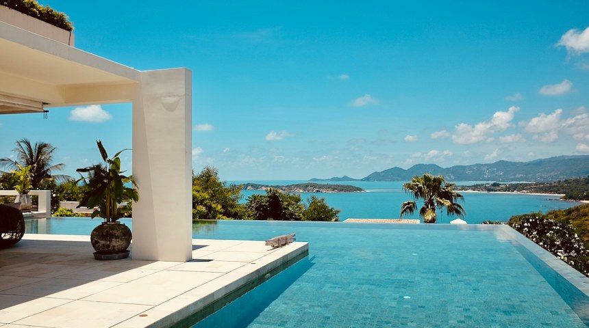 Infinity pool overlooking the sea at a luxury resort in Thailand