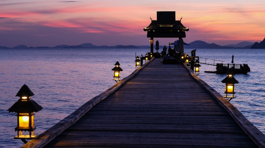 Wooden dock stretching into calm turquoise sea
