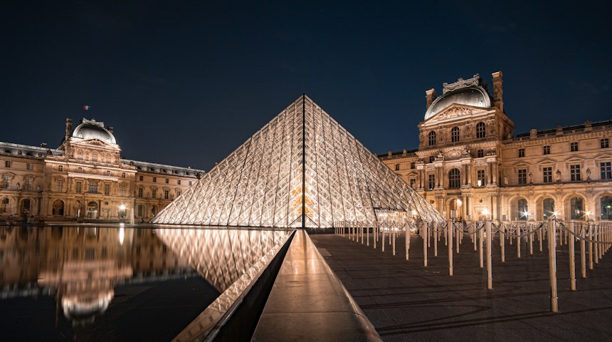 The Louvre pyramid illuminated at night