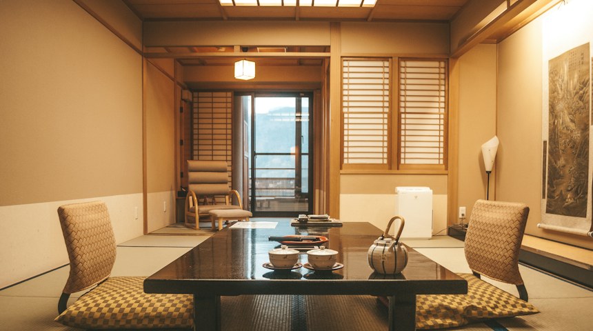 Wooden table beside a window in a traditional ryokan room