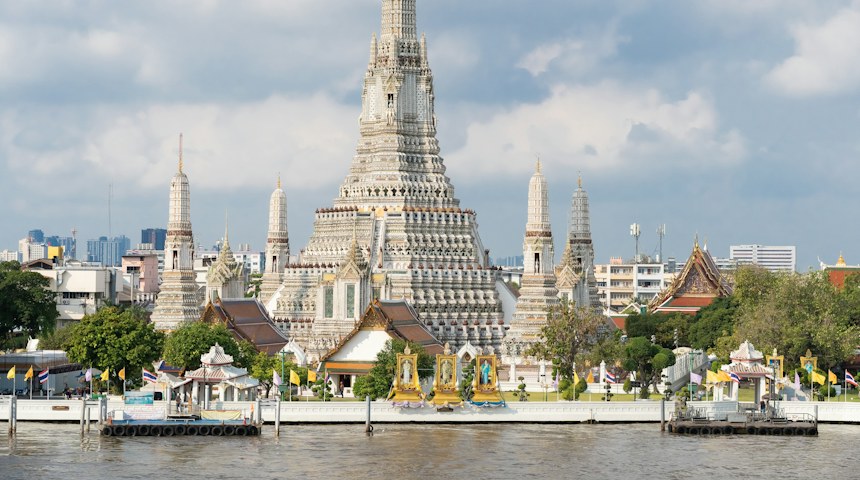 Wat Arun temple beside the Chao Phraya River in Bangkok