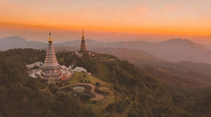 Aerial view of the White Temple surrounded by trees in Chiang Rai